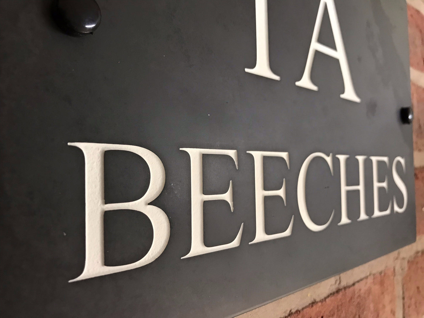 Introducing our stunning 30cm x 20cm Polished Natural Slate House Sign, designed to make a lasting impression! Crafted with durability in mind, it features beautifully carved lettering that enhances its elegance and visibility. Transform your home's entrance with this exquisite sign! www.HouseSign.co.uk