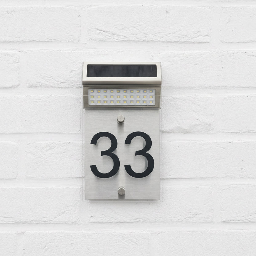 LED Solar Acrylic House Sign on a white painted wall www.HouseSign.co.uk 