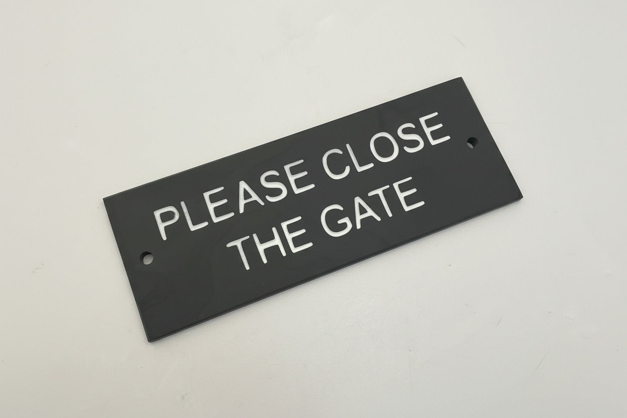 A Please Close The Gate Sign made in Natural Slate with polished edges and hard-wearing carved lettering www.HouseSign.co.uk