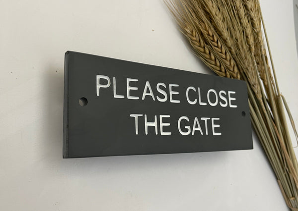 A Please Close The Gate Sign made in Natural Slate with polished edges and hard-wearing carved lettering www.HouseSign.co.uk